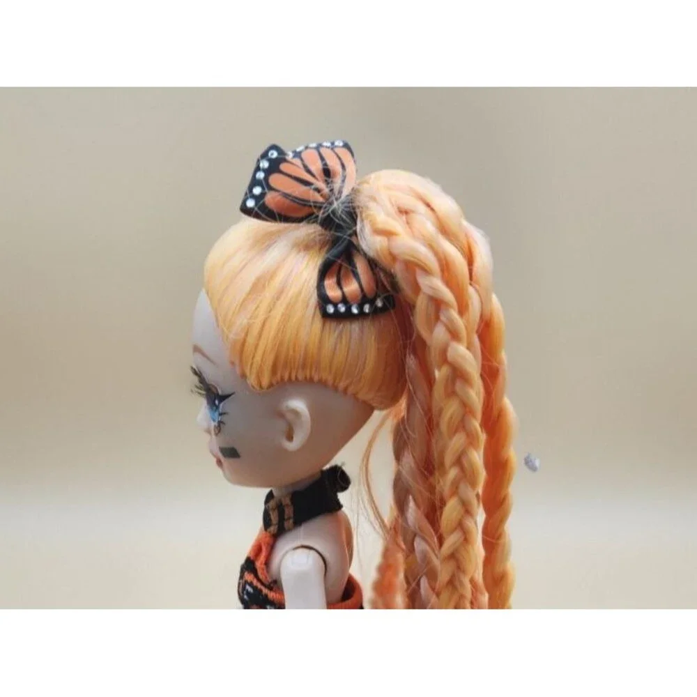 Rainbow High Junior Poppy Rowan Orange Fashion Doll Butterfly Monarch Bow
